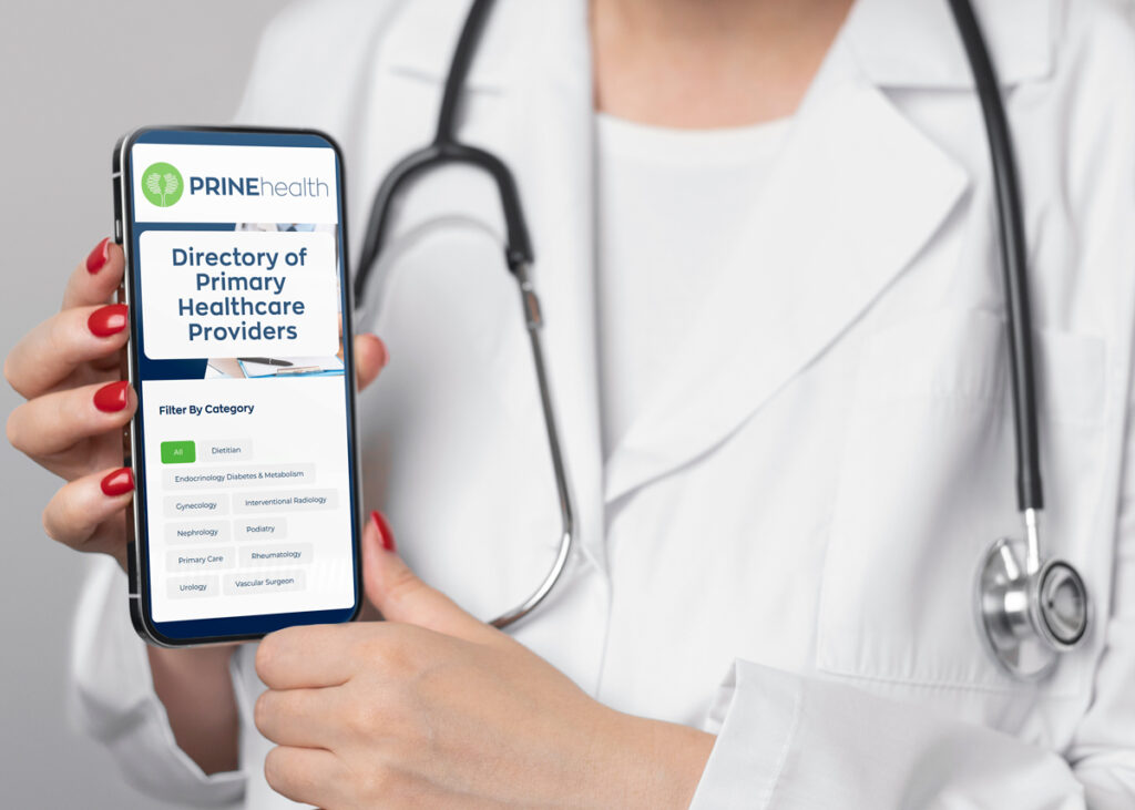 Doctor holding a phone with PRINE Health Provider Directory on the screen.